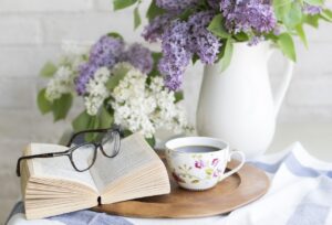 image showing one of the personal development books along with flowers and coffee
